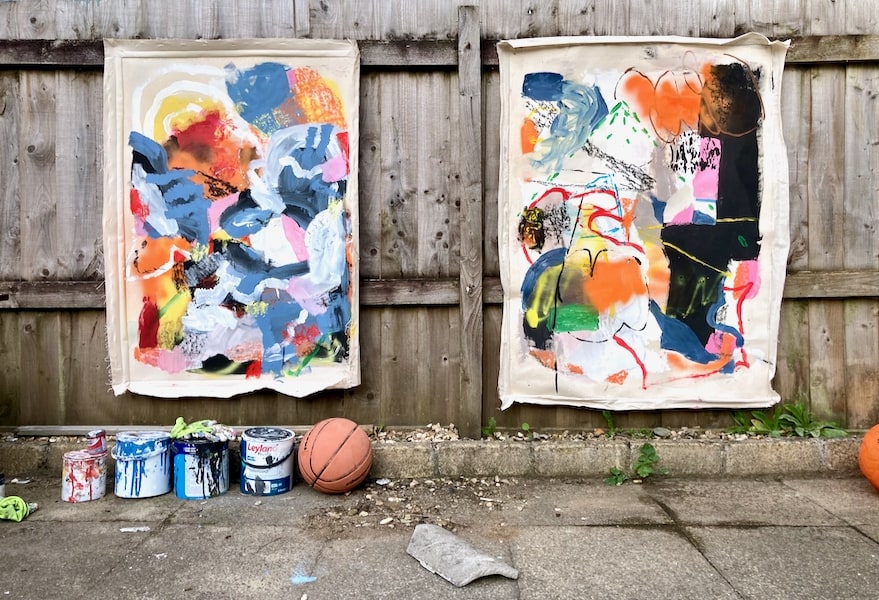 Collection of abstract paintings displayed in a Cornwall garden