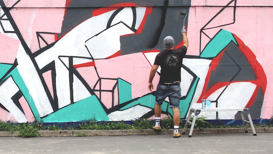 Graffiti mural artwork painted on an outdoor wall